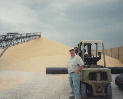 Photo of Farmers Coop Exchange Employee Unloading grain with a forklift
