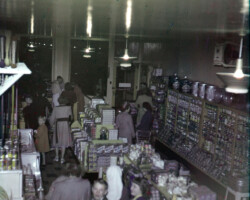 Inside of Farmer's Union Coop building on Franklin St. Grocery store, meat locker and office. Pella Opera House today